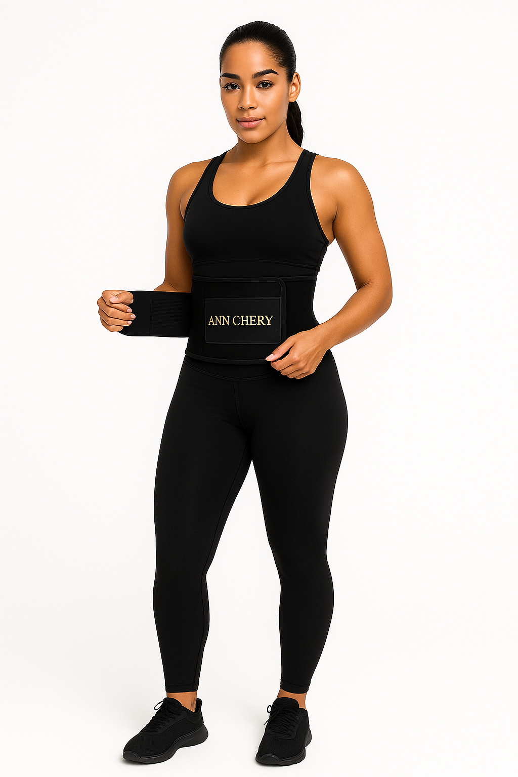 Woman wearing a black sports bra and leggings with 'ANN CHERY' branding on a white background